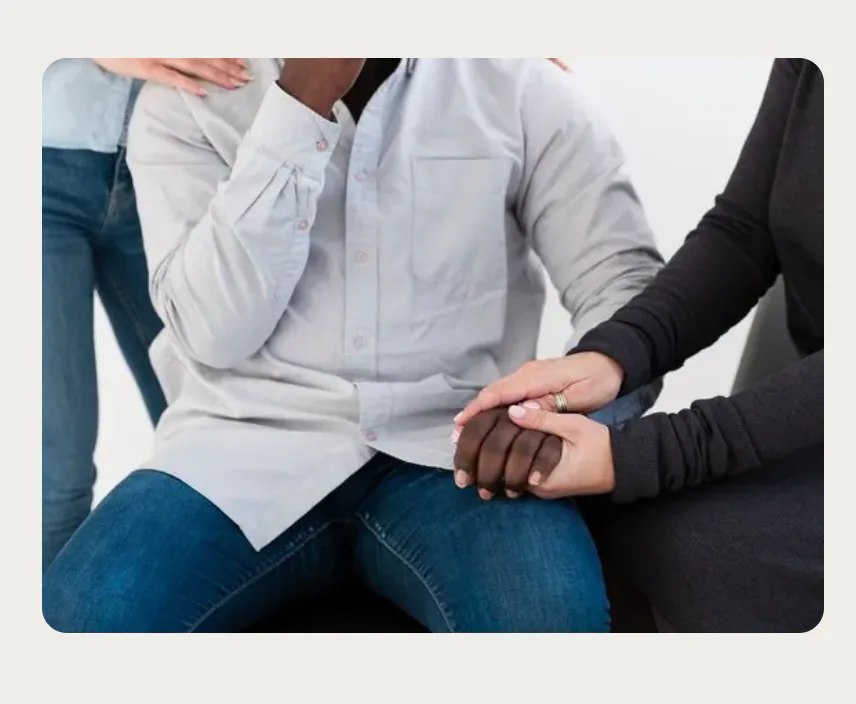 Person receiving compassionate support during alcohol addiction treatment