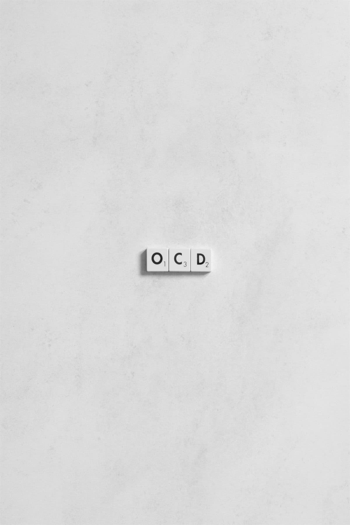 Letter tiles spelling OCD on a white background